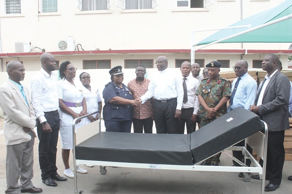 DCOP Dr Tetteh-Korboe thanking Harry Sitim Aboagye after receiving beds on behalf of the hospital