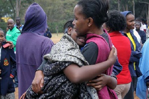 Parent hugging her child (file photo)