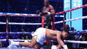 Daniel Dubois watches on as Anthony Joshua goes to the ground after a stunning right hook