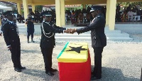 Outgoing IGP (2nd left) handing over to IGP Asante Apeatu