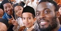 Michael Essien with the children