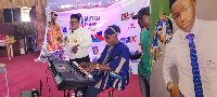 The young Phil trying his hands on the keyboard during the event