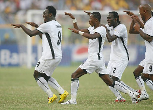 Essien celebrating with his Black Stars teammate after scoring in the 2008 AFCON