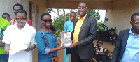 A student receiving her gift during the presentation