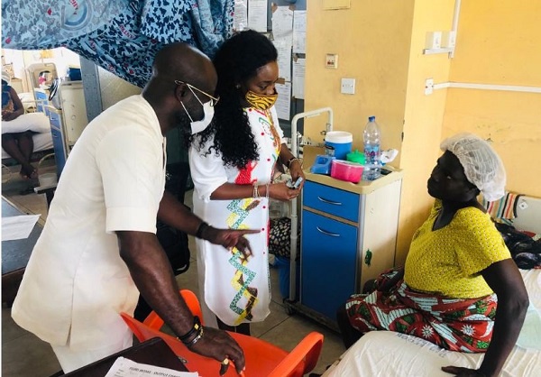Nana Asante Bediatuo and wife interacting with a patient