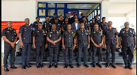 The IGP in a pose with some of the newly-promoted police personnel