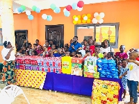 The items donated include bags of rice, Cooking oil, boxes of soft drinks, milk and packs of water,