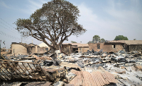 Burned homes sit days after an attack in the village of Woro, Nigeria, Feb. 5, 2026