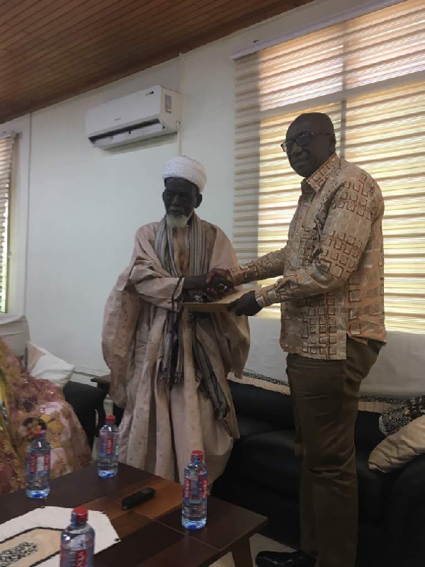 National Chief Imam presenting the petition to the Interior Minister, Ambrose Derry