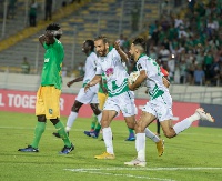 Raja Club Athletic player celebrates after scoring a goal during the match