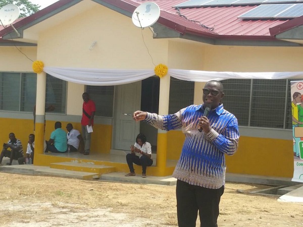 Mr. Emmanuel Armah-Kofi Buah delivering a speech infront of the new health facility