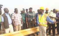 Kwasi Amoako Atta interacting with the project manager at Buipe