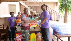Operations manager of the foundation, Mr. Papayaw Asamoah, presenting the items to the orphanage
