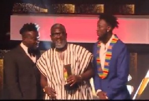 Bullet and Ebony's father receiving the award
