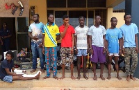 The eight suspected armed robbers in police custody