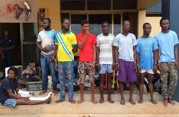 The eight suspected armed robbers in police custody