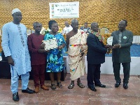 Michael Agyeibi Agyekum, Kwaebibirem Rural Bank, receiving the award from Noble Dr. Dee Otibu-Asare