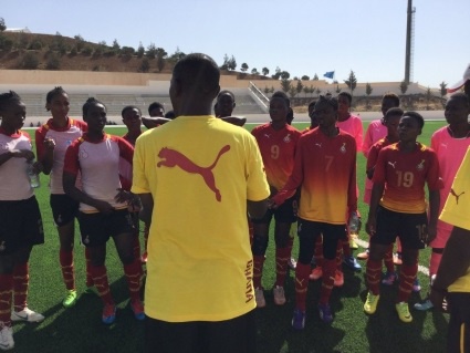 Players of Ghana's Black Maidens paying attention to their coach Yusif Basigi