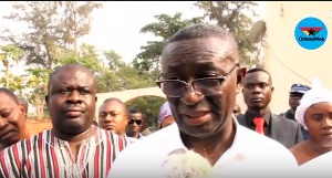 Andy Appiah-Kubi, Asante Akim North MP in glasses speaking to the media