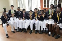 DPSI team displaying trophies and medals won at the Global Round of the World Scholar's Cup
