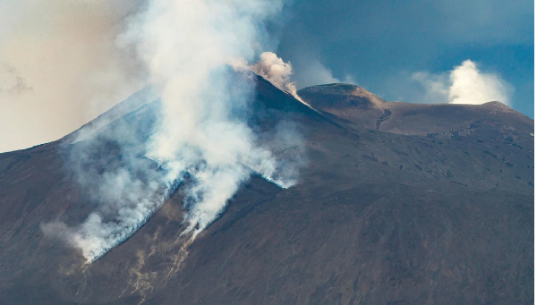 Smoke billows from Mount Etna as tourists fled its latest eruption