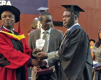 Gilbert Kenneth Adjei receiving his award