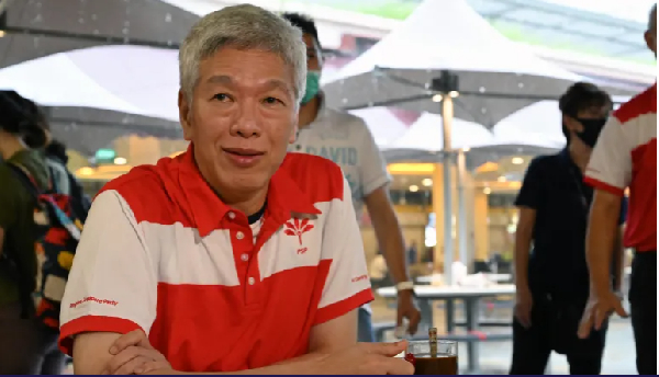 Lee Hsien Yang, son of the city state's founding father Lee Kuan Yew sits for a coffee