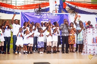 Dr. Kingsley Agyemang with some of the basic school children