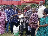 Angmortey Henry Numo, receiving his price for adjudging as the Best Farmer