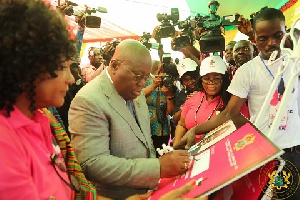President Akufo-Addo signs on a certificate
