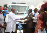 Daniel Kwaku Korankye (right) presenting the keys of the ambulance to Dr Alexander Obeng