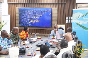 A photo of the Minister of Transport, Joseph Bukari Nikpe and other officials