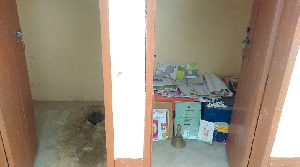 The distressed school uses a latrine pit as an office