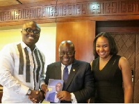 Bola Ray presented a copy of his yet to be released biography to President Akufo-Addo
