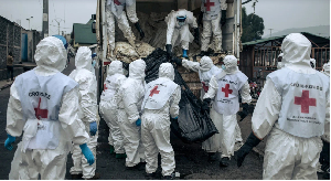 Members of the Congolese Red Cross and Civil Protection unload the bodies