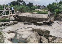A file photo of a destroyed bridge in Kenyasi due to heavy rainfall