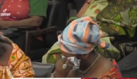 Queen Mother of Mpohor wiping the tears off her face