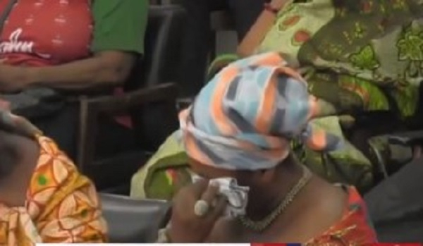 Queen Mother of Mpohor wiping the tears off her face