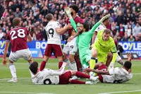 Foul on Arsenal's David Raya (in green jersey) led to cancellation of West Ham's goal
