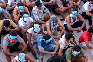 Trafficking victims wait at KK Park near the Thailand-Myanmar border