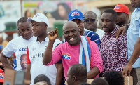 Odeneho Kwaku Appiah flanked by the other regional executives while addressing Obuasi market traders