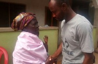Listowell Yesu Bukarson in a handshake with 72-year old mother of missing journalist