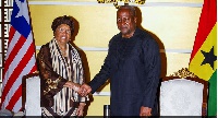 President Mahama in a handshake with President Ellen Johnson Sirleaf