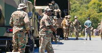 South African National Defense Forces deploy in the RIverlea township of Johannesburg, South Africa