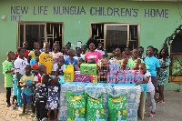 Diana Hamilton donating to the children