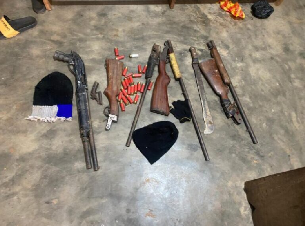 Weapons including multiple firearms, live cartridges, face masks, and other tools were retrieved