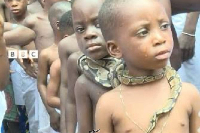 Kids with snakes around their necks