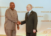 President John Dramani Mahama exchanging pleasantries with President Putin