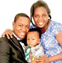 Pastor Ato Kessie in a pose with the wife and child