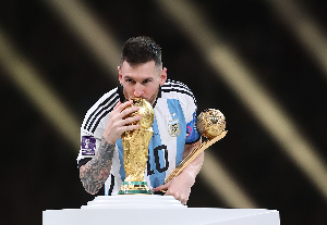 Lionel Messi kissing the World Cup trophy back in 2022